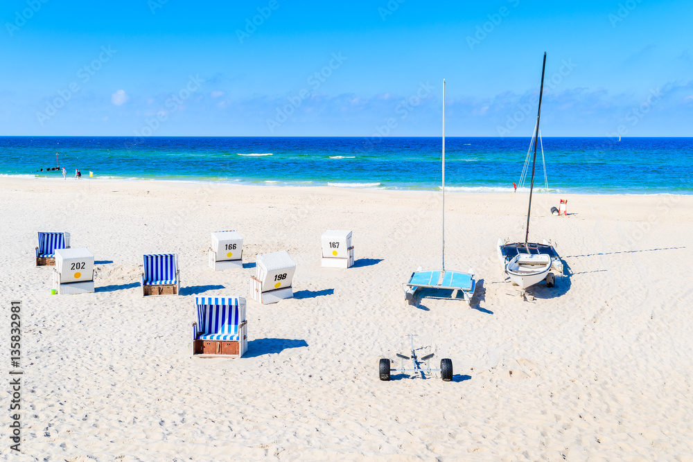 Chairs on sandy beach in Kampen village on coast of North Sea, Sylt island, Germany