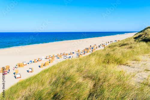 Grass on sand dune and view of white sand Kampen beach on Sylt island  Germany