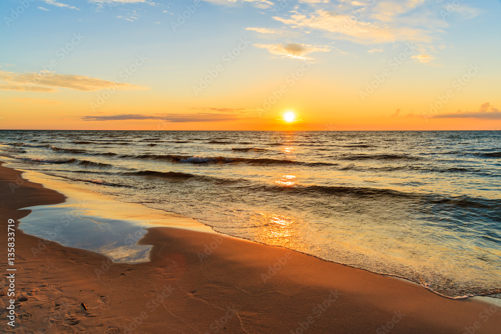 Sunset over sandy beach in Leba, Baltic Sea, Poland