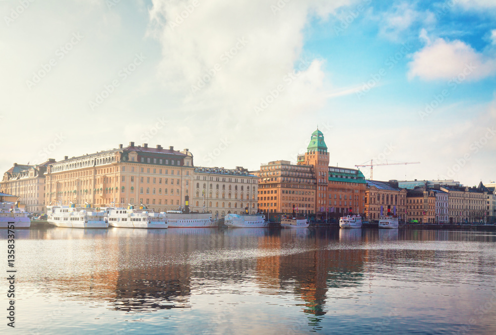 Scenic waterfront panorama of the Old Town in Stockholm, Sweden, retro toned