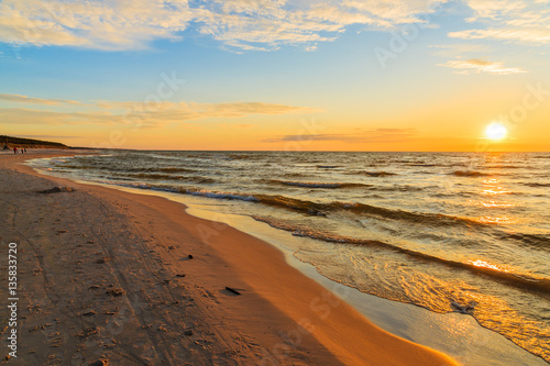 Sunset over sandy beach in Leba, Baltic Sea, Poland