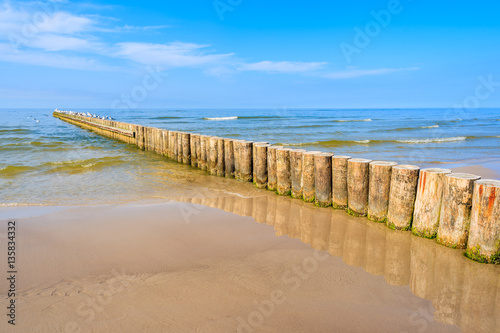 Breakwaters on sandy Leba beach, Baltic Sea, Poland