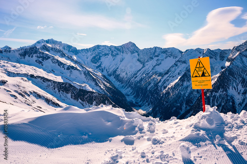 Sign warning of avalanche danger in Austrian Alps during winter ski season, Ankogel area, Austria