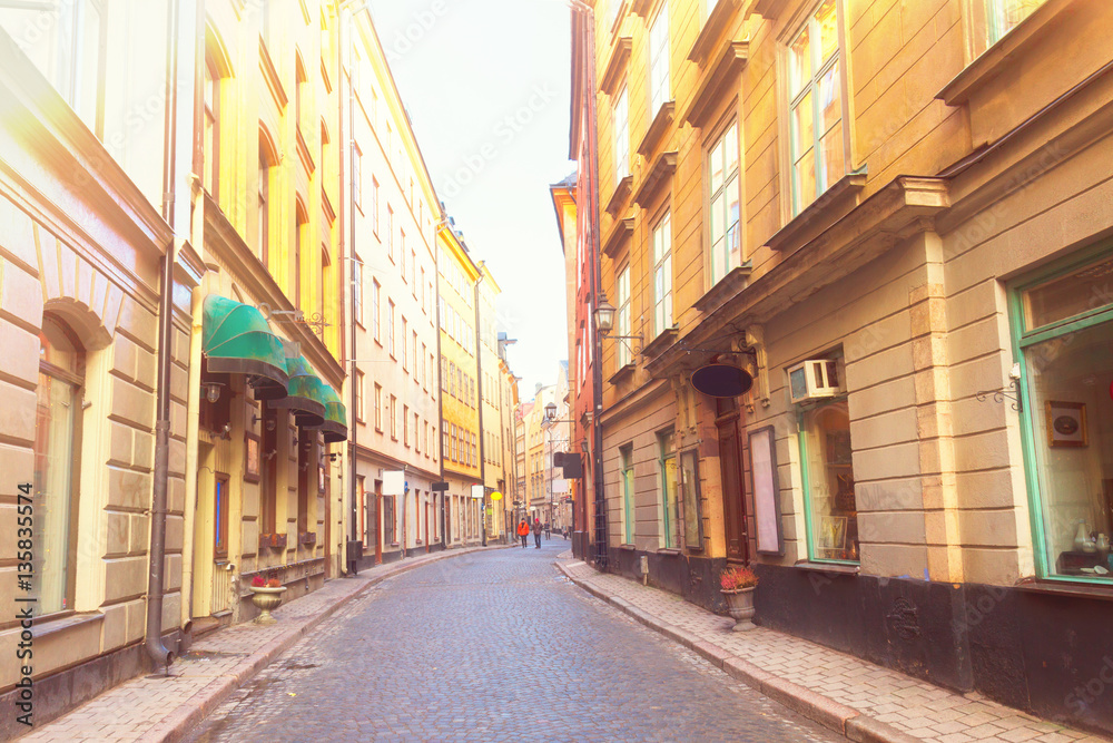 old town Gamla Stan street in Stockholm at day, Sweden, retro toned