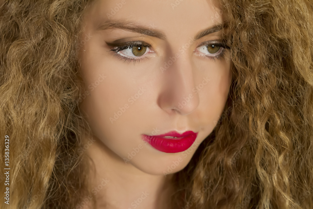 Beautiful glamour woman with long blond curly hair. Beautiful glamour woman with long blond curly hair.