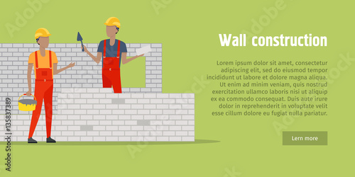 Wall Construction. Two men buildinng the wall