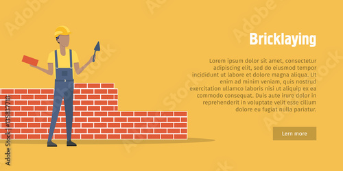 Bricklaying. Worker with spatula, brick in hands