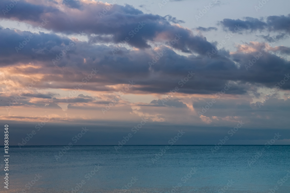 Calm sea with sunrise clouds Calm sea with sunrise clouds