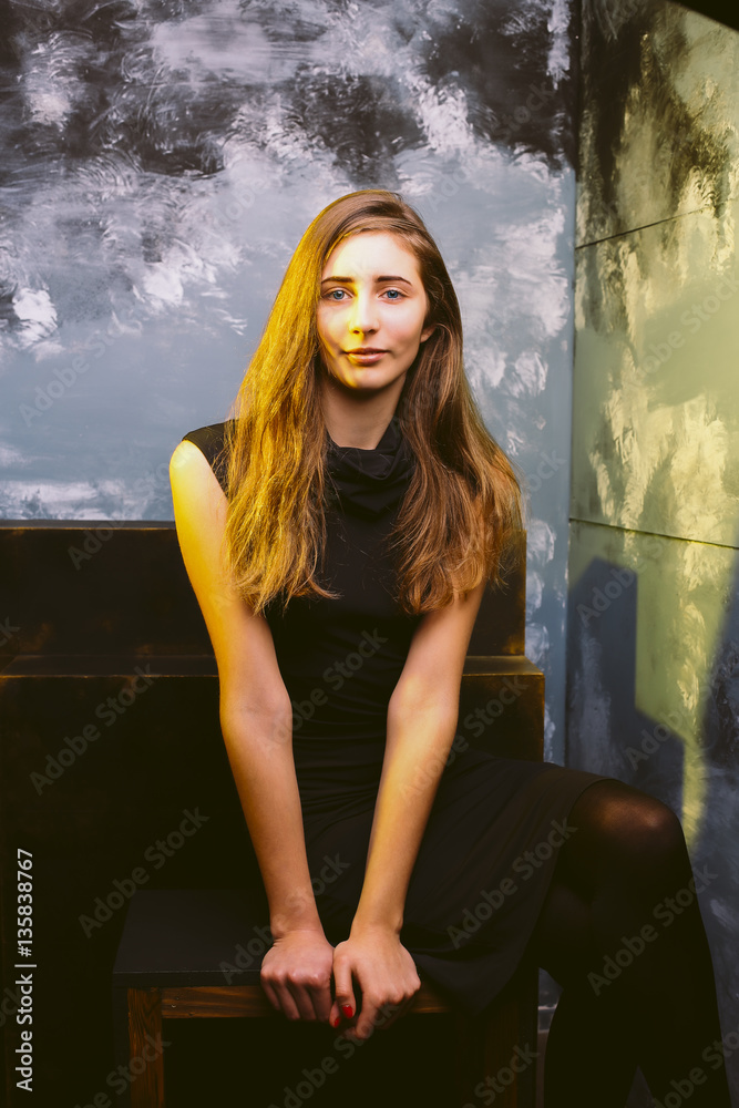 Naklejka premium Blonde woman with shadow on her face and lush hair