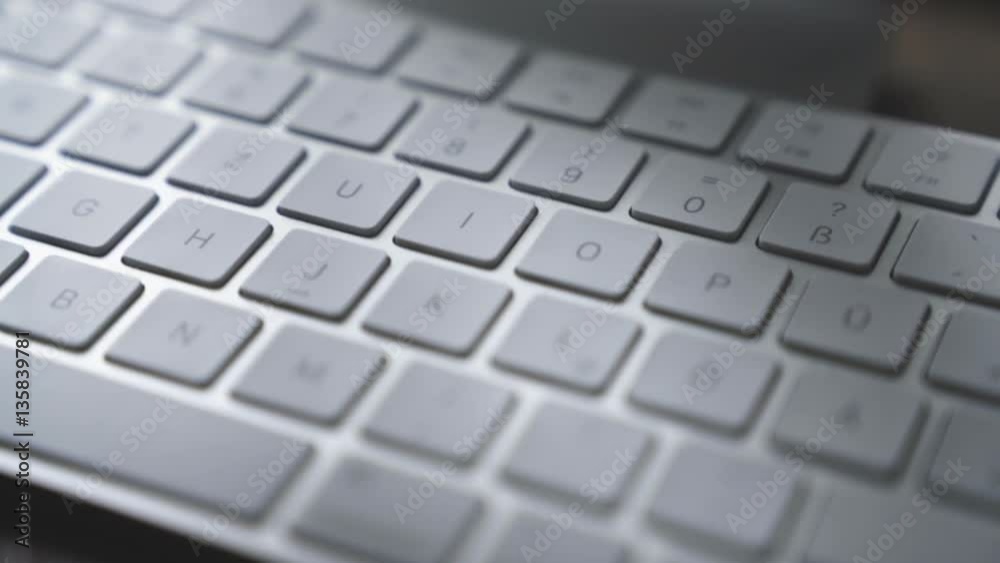 very close Close-up computer keyboard in office - business people, smooth tracking shot