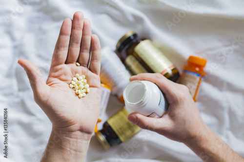 Vitamin, drags, pills and tablets in hand