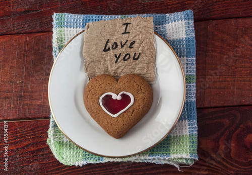  heart shaped cookies on white sauser photo
