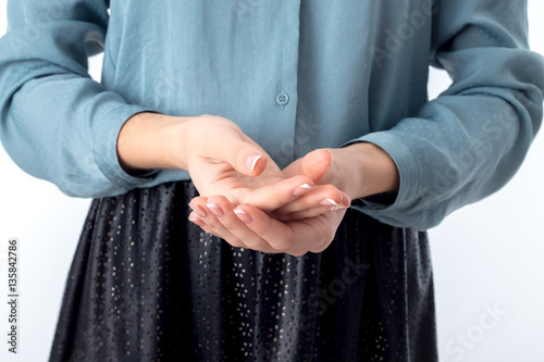 the girl pulled the hands folded their palms