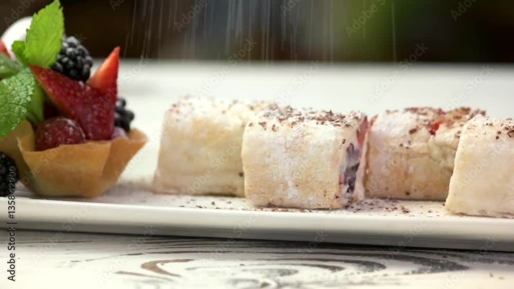 Sushi dessert rolls. Berries and powdered sugar. Sushi dessert rolls. Berries and powdered sugar.