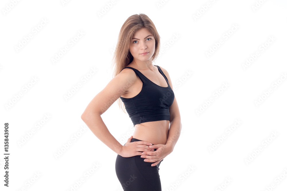 Athletic beautiful body of a young girl who is holding his hands at side Athletic beautiful body of a young girl who is holding his hands at side