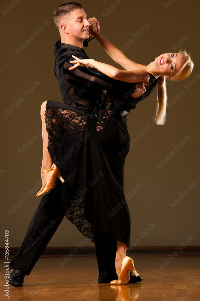 Beautiful ballroom  couple preforms their exhibition dance