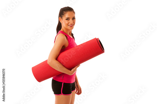 Woman with mat ready to workout isoalted over white background © Samo Trebizan