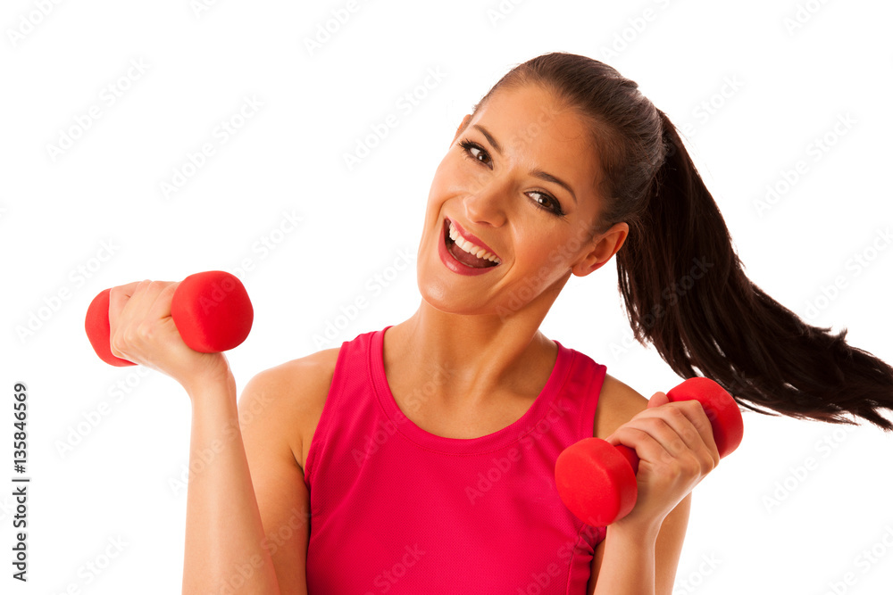Active young woman workout with dumbbells in fitness gym isolate Active young woman workout with dumbbells in fitness gym isolate