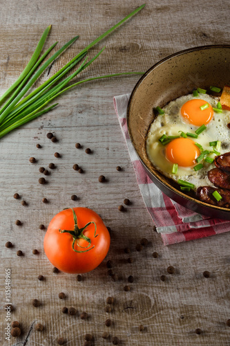 Ukrainian light breakfast. Breakfast in the pan on a wooden background