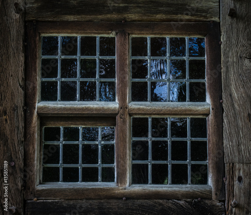 The window of an old,wooden farmhouse