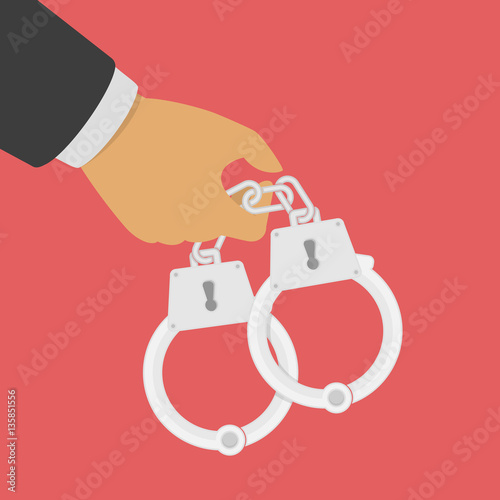 Handcuffs in his hands.