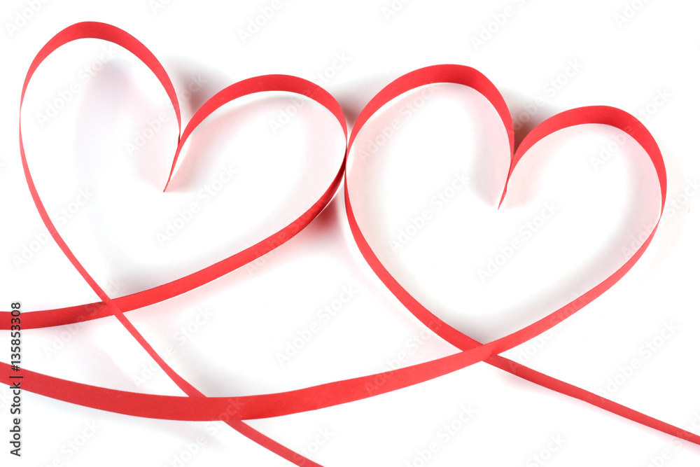 Two hearts made of red paper ribbon isolated on white background