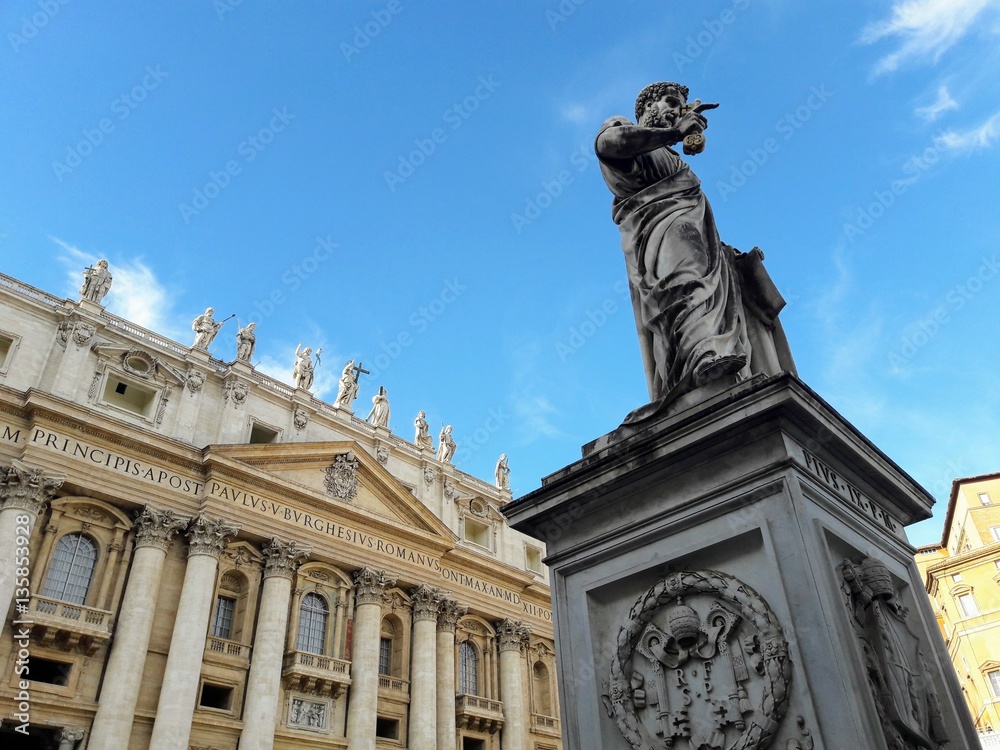 St. Peter's Basilica and statue of Pope Pius IX in St. Peter's Square Vatican City, Italy