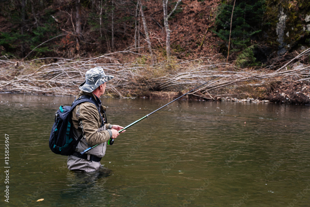 Grayling fishing on mountain river Grayling fishing on mountain river