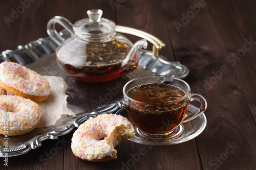 Fresh donuts for breakfast with tea