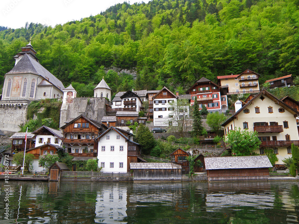 Scenic Traditional Waterfront Houses and Church on the Hallstatt Lake Shore, Austria 