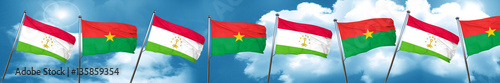Tajikistan flag with Burkina Faso flag, 3D rendering