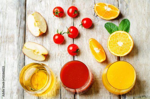set of juices: orange, tomato and apple