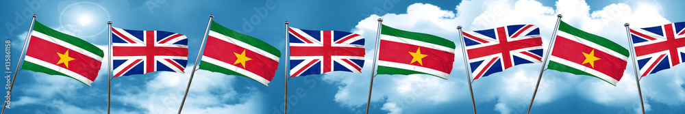 Suriname flag with Great Britain flag, 3D rendering Suriname flag with Great Britain flag, 3D rendering
