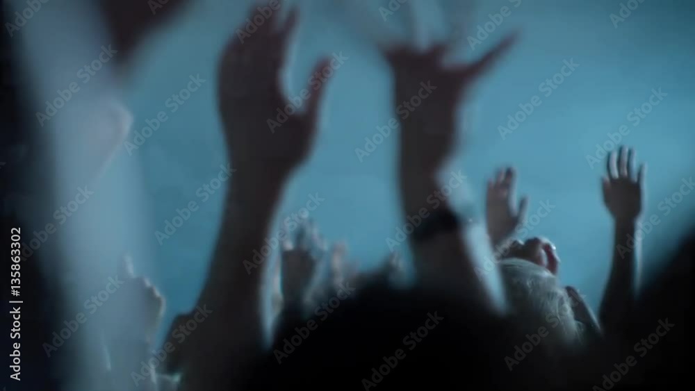 Hands in the air at a music festival - view from audience perspective