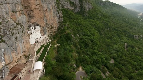 Aerial camera review of Ostroska Greda with upper Serbian Orthodox monastery of Ostrog and Bjelopavlici plain, Montenegro
 photo