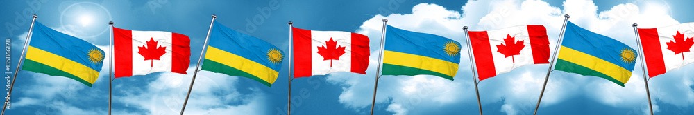 Rwanda flag with Canada flag, 3D rendering Rwanda flag with Canada flag, 3D rendering