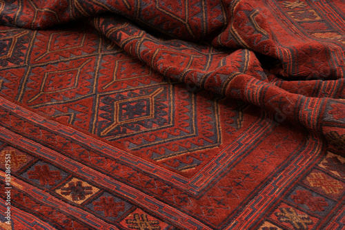 Close up of a hand woven and knotted afghan berjesta mashwani kilim rug photo