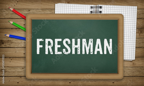 Freshman on blackboard, Education school concept