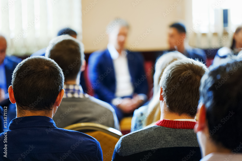 Business style dressed CEO lead the team building meeting in small class room. Education, Business Entrepreneurship concept. Business Conference and Presentation. Selective focus at rear view student.