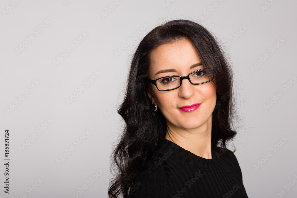 Fototapeta premium Portrait of a dark-haired beautiful girl close-up