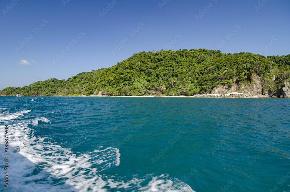 idyllic island with blue sky background