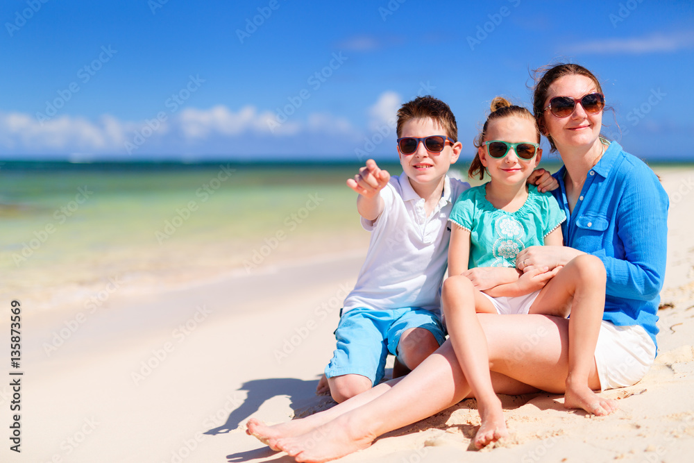 Mother and kids on a tropical beach