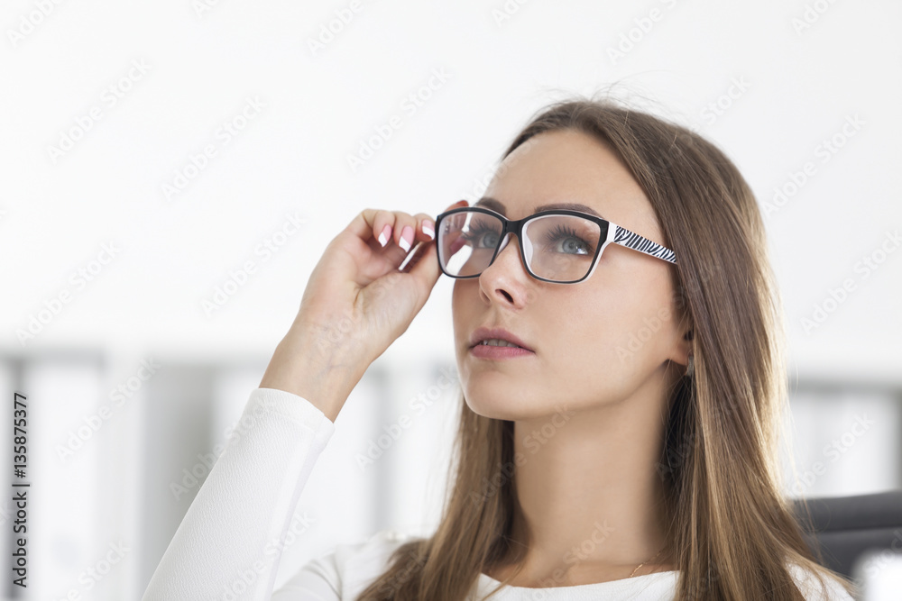 Front view of blond businesswoman in glasses