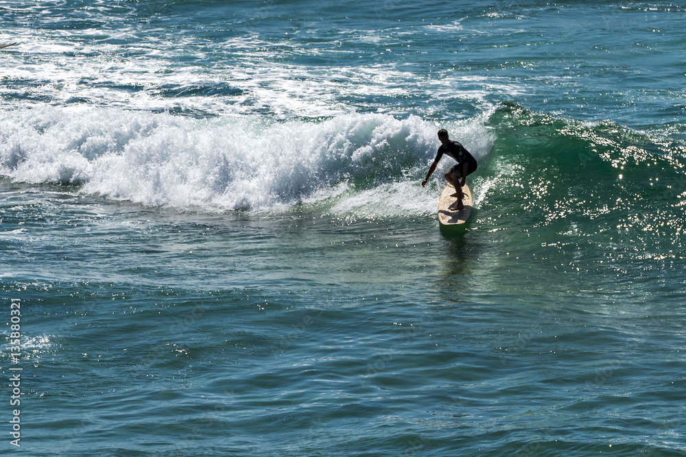 Sydney, NSW, Australia - DEC 01, 2015, Young surfer surfing at Bondi beach. Sydney, NSW, Australia - DEC 01, 2015, Young surfer surfing at Bondi beach.