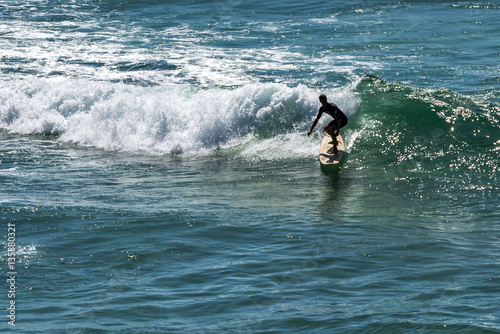Sydney, NSW, Australia - DEC 01, 2015, Young surfer surfing at Bondi beach.