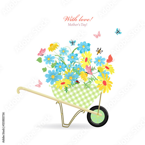cute garden wheelbarrow with wild flowers with love. mother's da