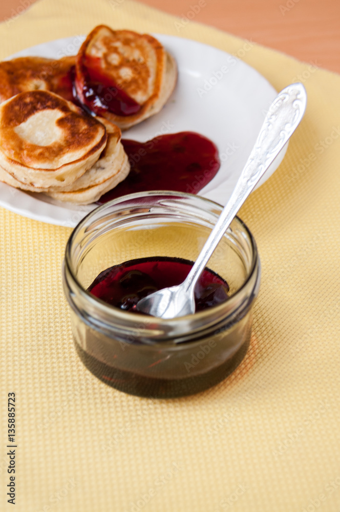 Delicious pancakes for breakfast with cherry jam Delicious pancakes for breakfast with cherry jam