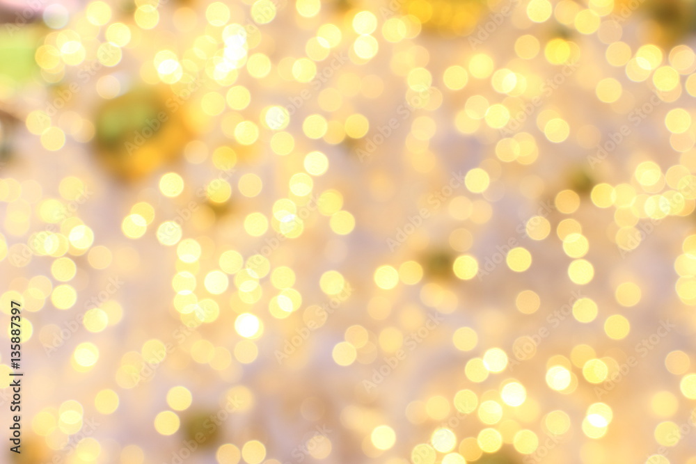 Golden ball ornament, bokeh lights on white Christmas tree blurred Golden ball ornament, bokeh lights on white Christmas tree blurred