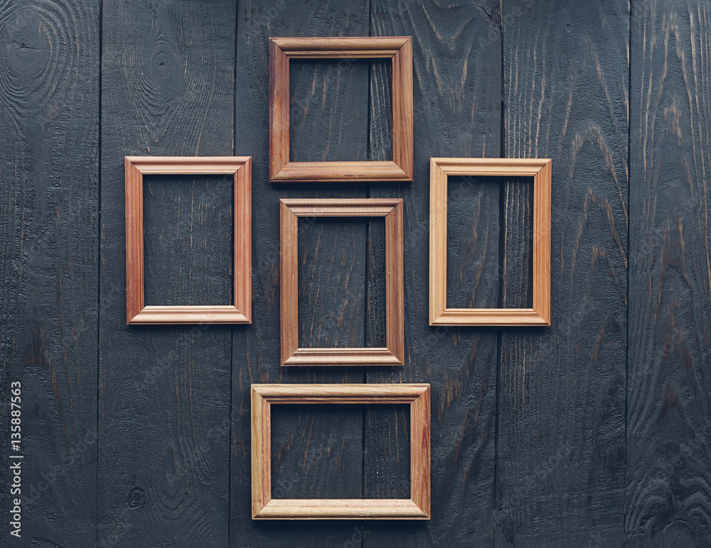old frames on wooden wall old frames on wooden wall