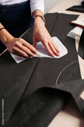 Tailor at work. Close-up of woman's hand